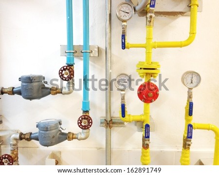 The equipment of the boiler-house, - valves, tubes, pressure gauges Royalty-Free Stock Photo #162891749
