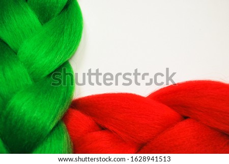 Kanekalon. Colored artificial hair strands. Synthetic hair materials for weaving African braids zizi. Close-up of bright colored hair. Overhead locks. Background for business cards.