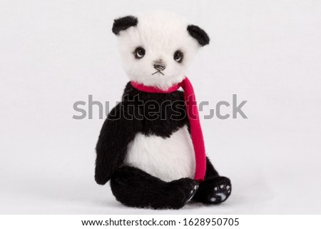 Black and white handmade artist teddy panda isolated on white background