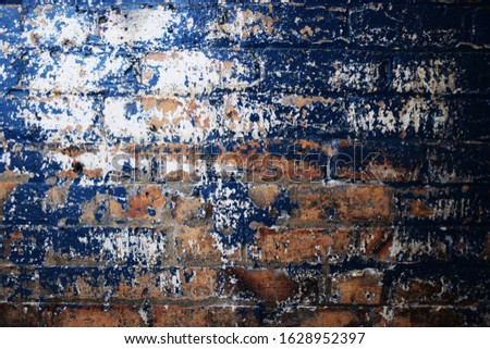 A blue painted and textured vintage wall paint effect in a basement hallway