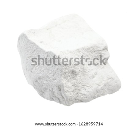 closeup of sample of natural mineral from geological collection - rough chalk (white limestone) rock isolated on white background