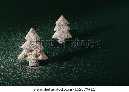 Christmas and new year gingerbread cookies on the green background