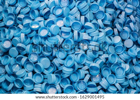 Plastic bottle caps background. Recycling collection and production processing plastic bottle caps  Royalty-Free Stock Photo #1629001495