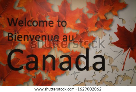 Welcome to Canada, in English and French language, on red/white leaves.