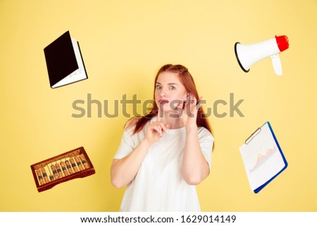 Listen to somebody. Caucasian young woman's portrait on yellow studio background, too much tasks. How to manage time right. Concept of working, business, finance, freelance, self management, planning.
