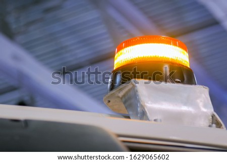 Close up of warning orange beacon flashing on roof of emergency, support and service vehicle. Danger, legal, alert light, attention and hazard concept