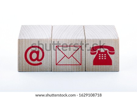 Wooden blocks. Symbol email, address and phone. Website page contact us or email. Marketing concept.