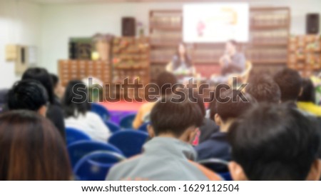 Abstract blurred photo background of business people in conference hall or seminar room.
Bokeh business meeting conference training learning coaching concept.