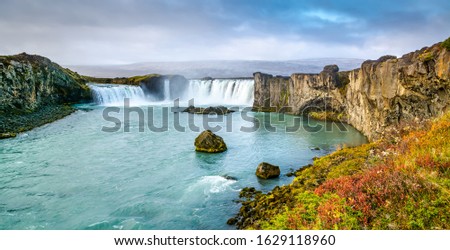 Fantastic panoramic view of powerful Godafoss waterfall. Dramatic sky over Godafoss. Location: Godafoss waterfall, Iceland, Europe. Artistic picture. Beauty world. Travel concept. 