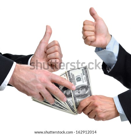Hands of two men giving and taking dollars