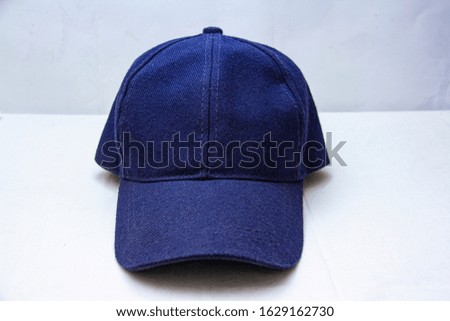 blue cap jeans with white background 