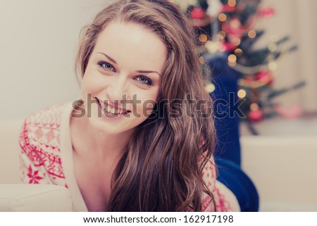 Smiling Girl Celebrating New Year at Home.Christmas Tree