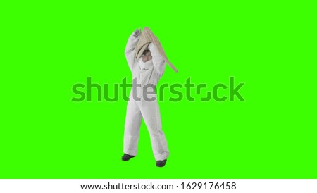 Girl in a spacesuit trying to put on a sweater 