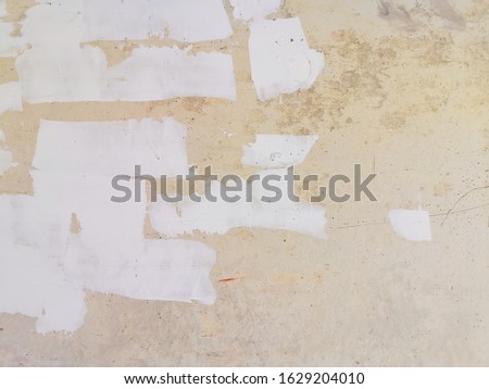 White brush on light retro grey stained cement grunge wallpaper background.