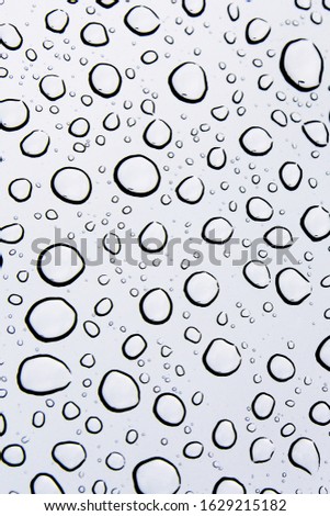Rain droplet on glass surface