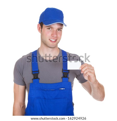 Portrait Of Happy Mechanic In Workwear Holding Visiting Card