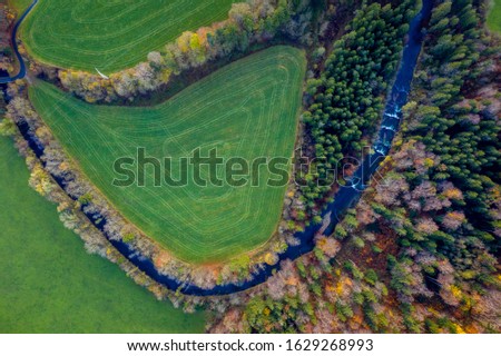 Aerial view Autumn landscape in Bavaria near Miesbach. top view of the field and autumn forest