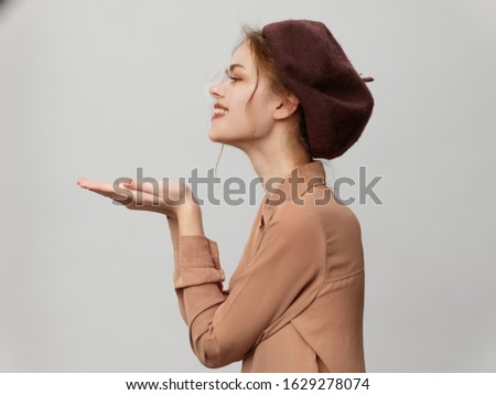 young woman in a beautiful hat in stylish clothes isolated background