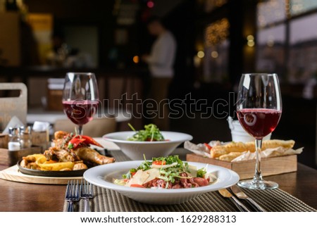 Valentines dinner romantic love concept / Romantic table setting decorated dinner night light background Royalty-Free Stock Photo #1629288313