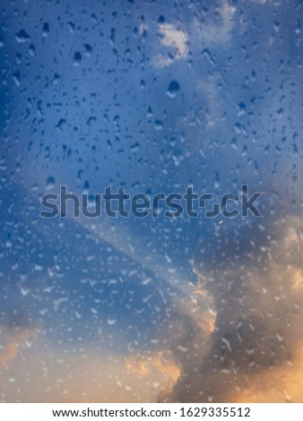 Defocus and blur abstract light blue sky with twilight and raindrops