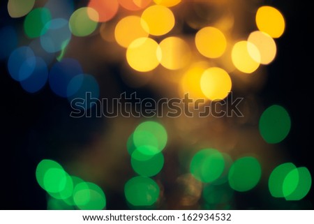 Abstract green and yellow circular bokeh background of Christmaslights