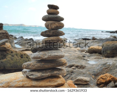 The layer of rocks and blue sea