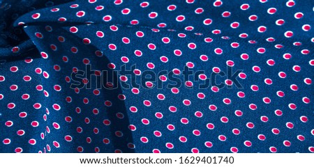 Texture background, pattern, blue silk fabric with red polka dots. Light and silky-soft satin pendant is perfect for your design, online projects. It is also perfect for screensavers and wallpapers.