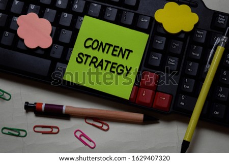 Content Strategy write on a sticky note isolated on office desk.