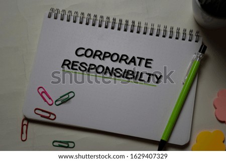 Corporate Responsibility write on a book isolated on office desk.