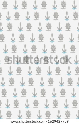 Creative pattern from shadows of marine rudders and anchors on a light grey background.