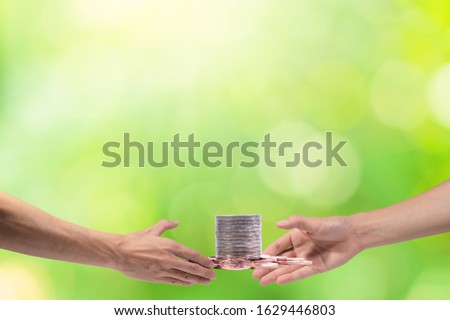 Hand catching money  scene background bokeh green
