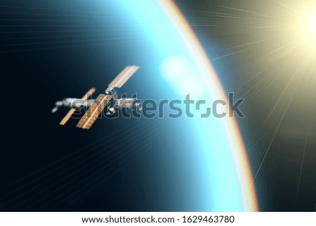 Space satellite orbiting the blue planet. Decorations for photo sattelite. Selected focus
