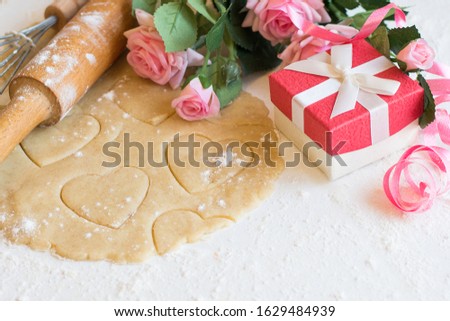 Valentines Day love cookies and flowers on wooden background. Good morning and happy Valentines Day.