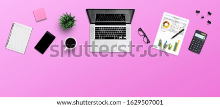 Top view office desk and supplies, with copy space. Creative flat lay photo of workspace desk/Panoramic banner isolated on pink background