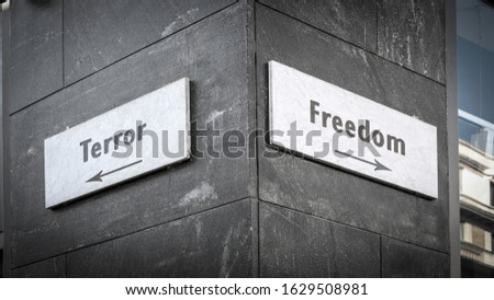 Street Sign the Direction Way to Freedom versus Terror