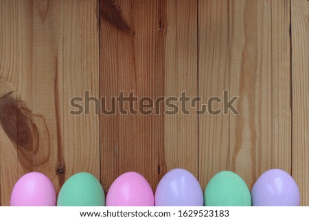 Zero waste happy easter. Colorful eggs on a light wooden background with copy space for text. Top to bottom or flat lay