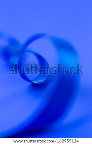Blue ribbon on blue background