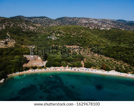 sivota beach named Dei The beach of PPC is located in the northern part of Sivota and its name is due to a central pillar of the electricity service located just before the beach. aerial photo drone