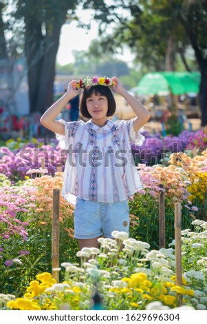 Asian cute girl in the flower garden