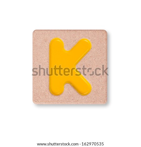 Letter K on wooden block isolated on white background