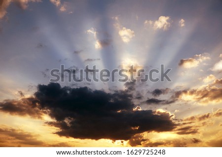Beautiful sunset with dramatic rays of light                              