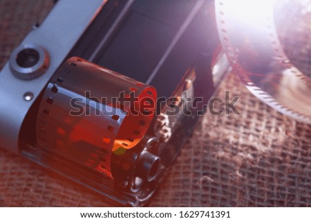 Photographic film template. Beautiful lighting. Shadows and relief of the film. Background image. The old camera.