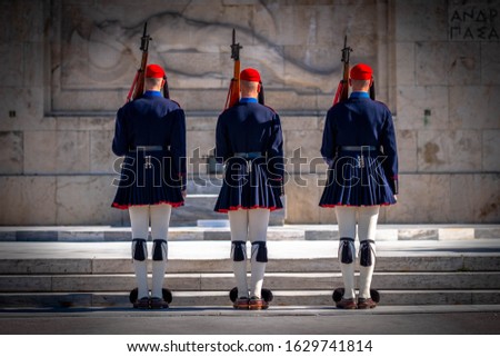 Presidential Guard on the Tomb of the Unknown Soldier. The Evzones or Evzonoi, is the name of several historical elite light infantry and mountain units of the Greek Army. Royalty-Free Stock Photo #1629741814