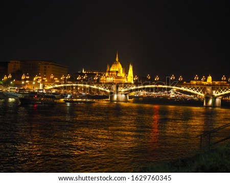 A beautiful night panorama of Budapest the capital of Hungary with Danube river and illuminated bridge and Parliament