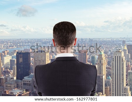 young man looking to the big city
