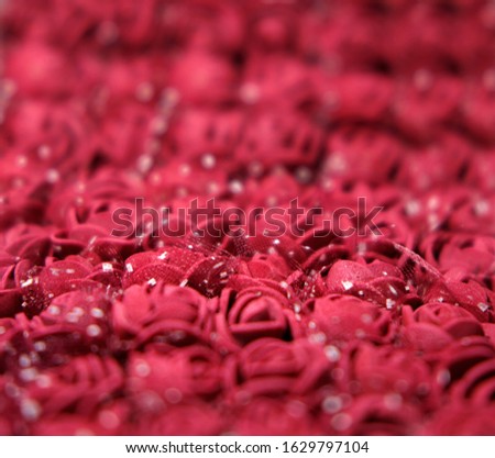 Background of beautiful artificial red bouquets of roses