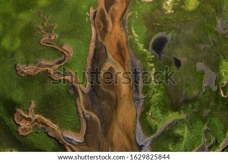 Aerial photography of Cape Cod`s awesome marshlands and pure wilderness. The picture shows green environment and an infinite diversity of the nature. Royalty-Free Stock Photo #1629825844