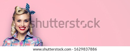 Portrait of excited very happy woman. Pin up beautiful blond girl. Retro and vintage concept. Pink color background. Copy space for some text. 