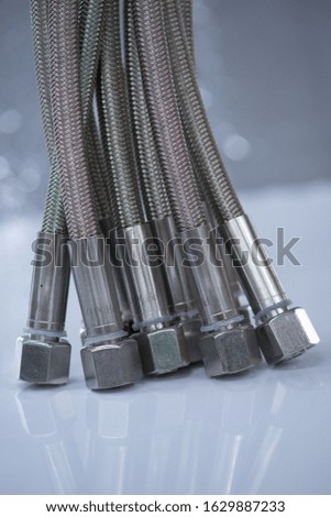 Stainless steel pressure hose with screw connection.