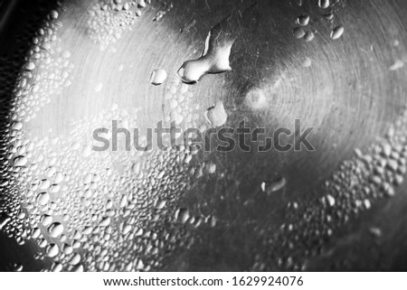 Waterdrops on metal, detail shot                               